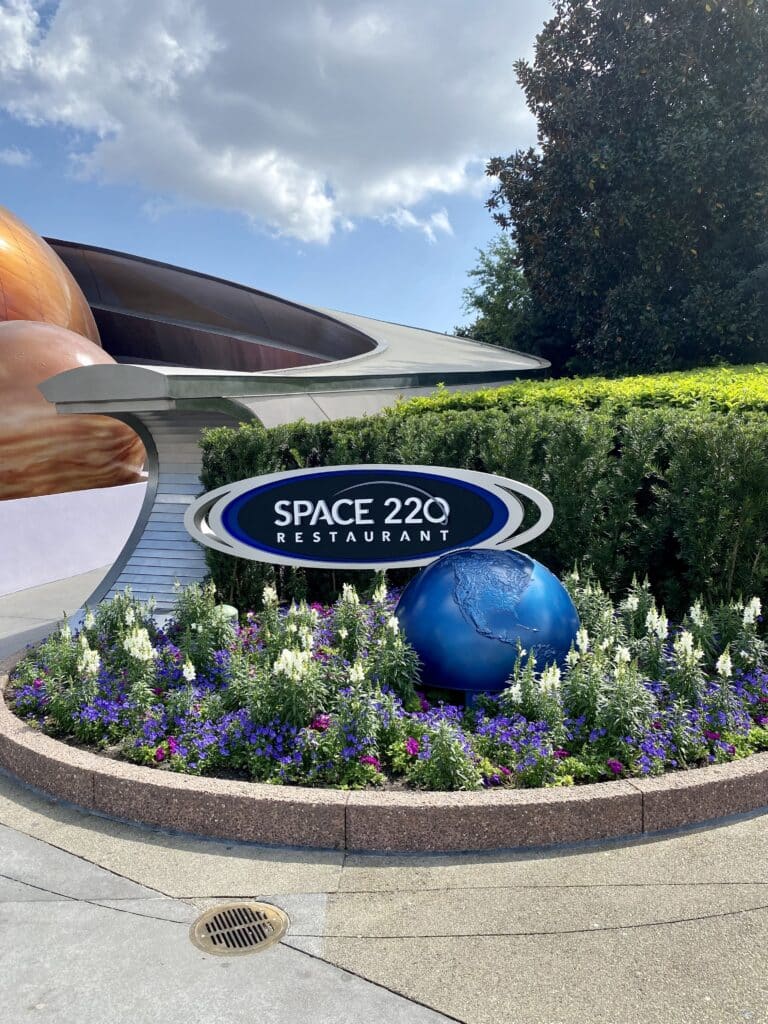 Space 220 is one of the hardest Disney dining reservations to get at Epcot #space220 #epcot #disneydining #disneydiningreservations #disneyfood #disneytips #disneyvacation #disneytrip #travelagent