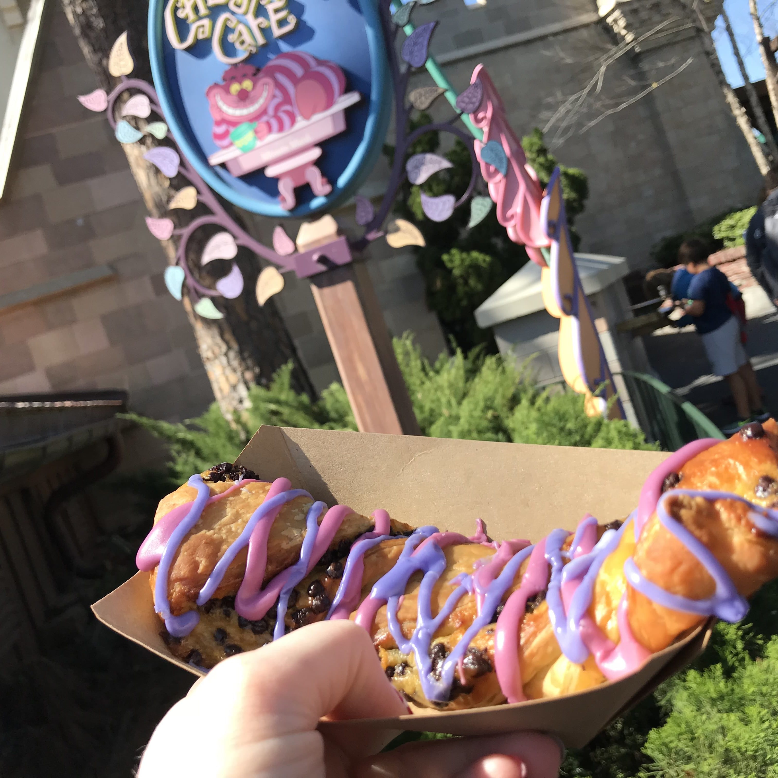 Cheshire Cat Tail - best snacks at Disney World! #disneyworld #disneyfood #disneysnacks #disneytrip #disneyvacation #travelagent