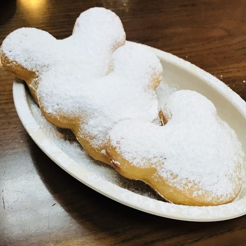Mickey Beignets - best snacks at Disney World! #disneyworld #disneyfood #disneysnacks #disneytrip #disneyvacation #travelagent